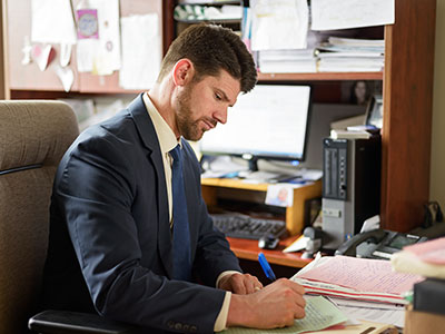 attorney reviewing probate and trust administration documents